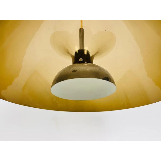 Vintage pendant lamp by Temde in the 1970s. It is made from acrylic glass and plastic. Measurements: Height: 20-80 cm...