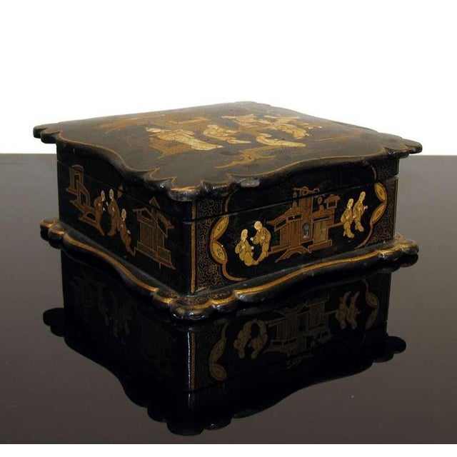 Asian Decor Jewelry Box in Black Lacquer Napoleon III. A squared jewelry box with ribbed edges, decorated with gold...