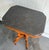 Eastlake style carved wood side table w/ grey marble top and original caster feet. Excellent condition.