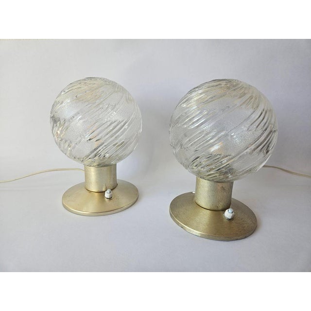 Very rare type. Rare in pair. Beautiful type of lighting. This piece is attributed to the mentioned designer/maker. It has...