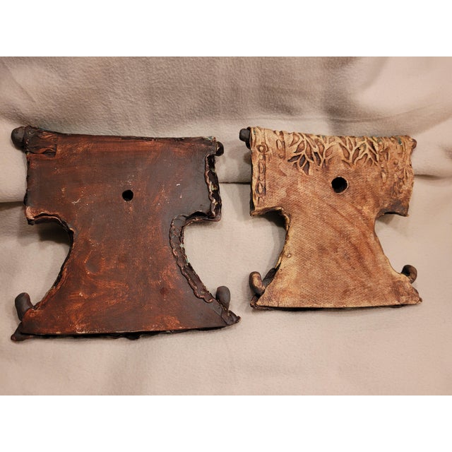 People wrapped in colorful robes - Could look Eskimo-ish but we thought they were Polynesian - Interesting details with...