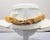 Circa 1990 Goldtone textured openwork wavy "ribbon" articulated collar necklace with fold over clasp. Marked "Napier" in...
