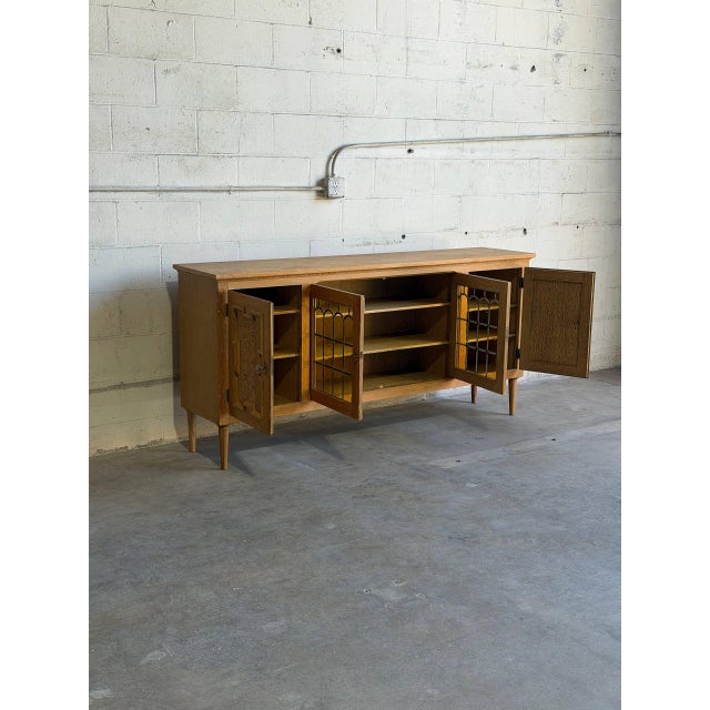 Beautiful vintage Danish oak sideboard / cabinet in style of Henning featuring stunning Brutalist-style carved doors...