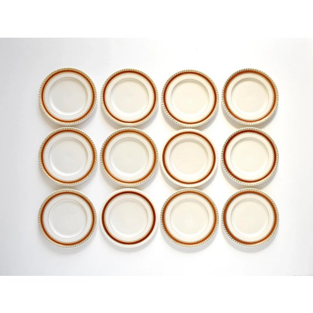 A set of 12 vintage 1934-1948 Lenox china small 8 1/4" salad or dessert plates, in the deep red burgundy and gold gilt...