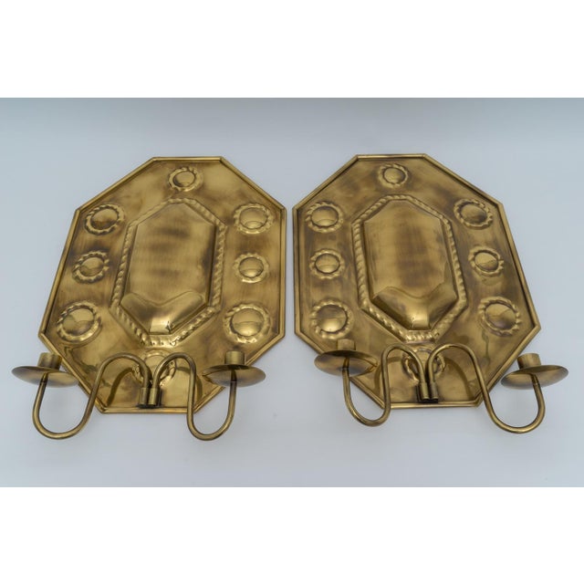 This stylish pair of hand-crafted brass candle wall scones were acquired from a Palm Beach estate and could be used with...
