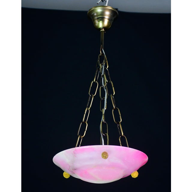 Antique pink alabaster hanging chandelier in Art Deco style, circa 1940s. A unique piece in pink alabaster, beautifully...