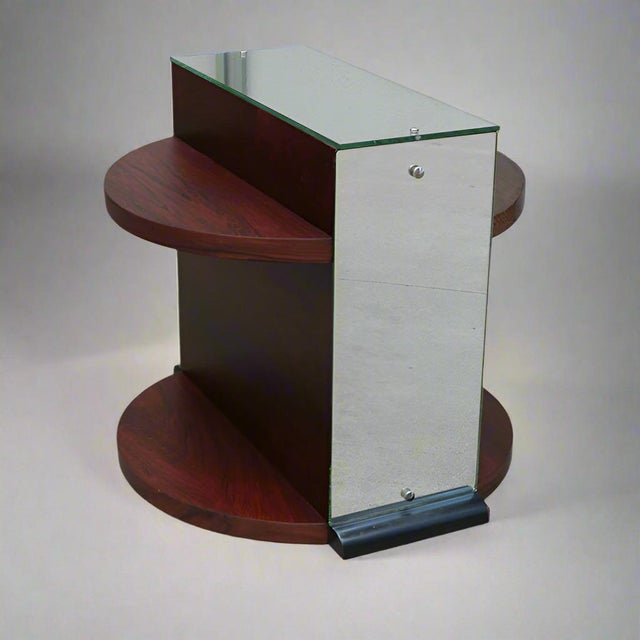 A unique French Art Deco period table from France circa 1930. The top and front and rear surfaces are clad in mirror...