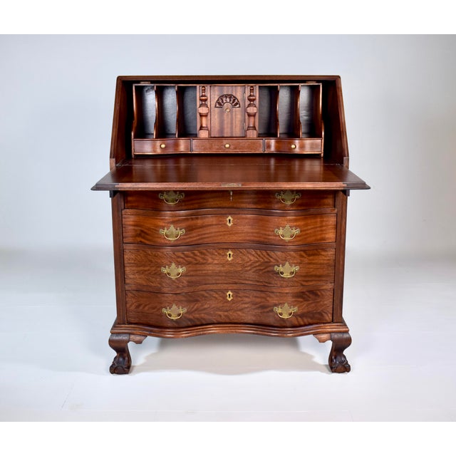 Beautifully. maintained all original 1920s Chippendale Mahogany secretary slant top desk featuring fold-out writing...