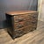 Stunning French Louis XV commode crafted in richly figured oak wood with distinctive inset ebony accents outlining the...
