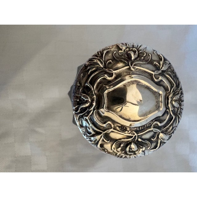 This is a petite sterling silver topped, Art Nouveau powder jar. The lid has the word "sterling" next to the cartouche,...