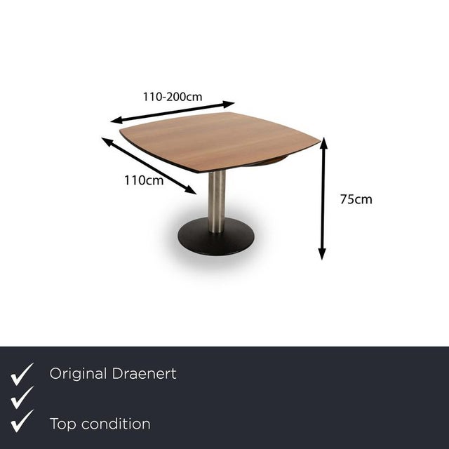 This stylish Titan III wooden dining table from Draenert combines modern design and functionality. The square table top...