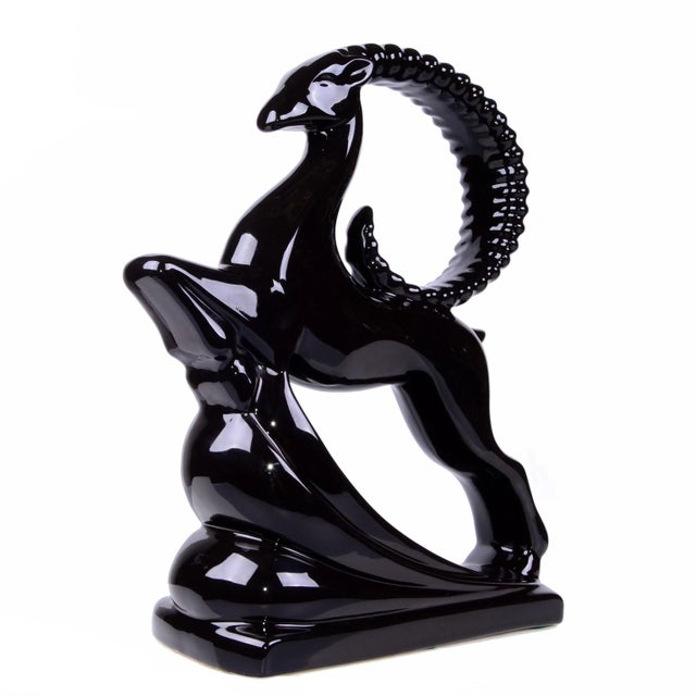 Large glazed black ceramic ram sculpture. No markings. Great curves and lines. A-585-344