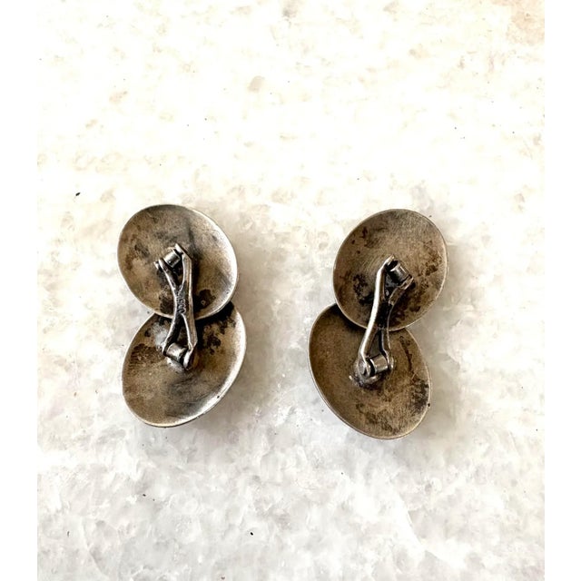 Handsome pair of oval shaped antique sterling silver cufflinks.