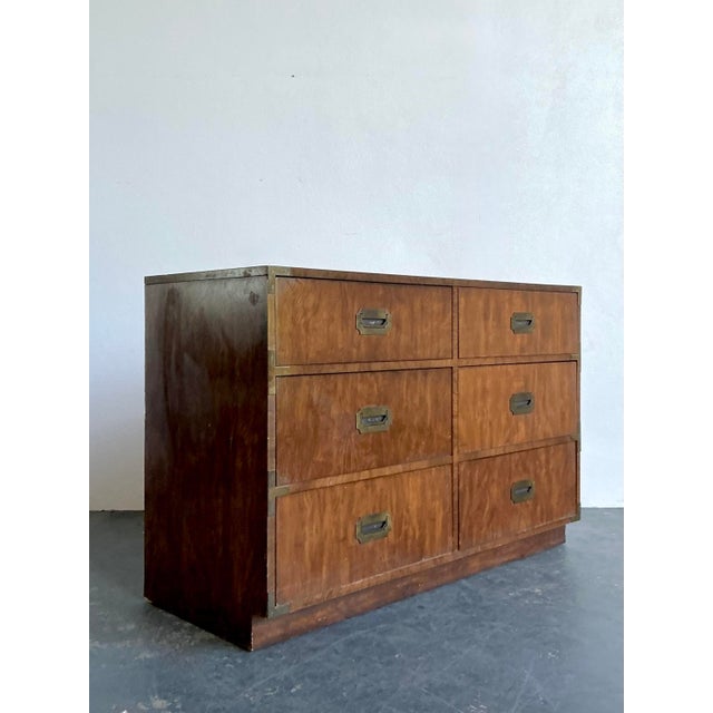 This vintage campaign dresser by Dixie represents a timeless fusion of military-inspired structure and Mid-Century Modern...