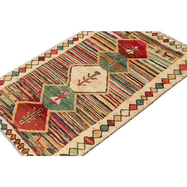 This vintage 4x6 Persian tribal runner is hand-knotted in wool, and originates circa 1950-1960. On the Design: The design...