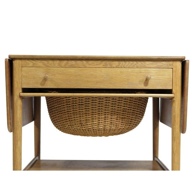 Danish side table designed by Hans J. Wegner for Andreas Tuck, Model AT-33. Handcrafted from solid white oak, the table...