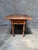 A warm, useful antique American one-drawer drop-leaf table, mid-19th century. The rectangular center section carries two...