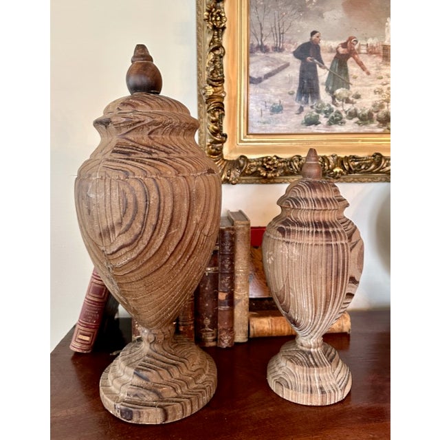 Want to add some warmth and texture to your home? This pair of Uttermost solid wood finials are great and make a...