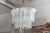 This beautiful Venini style chandelier is draped with three different sizes of heavy trihedral glass prisms. The differing...