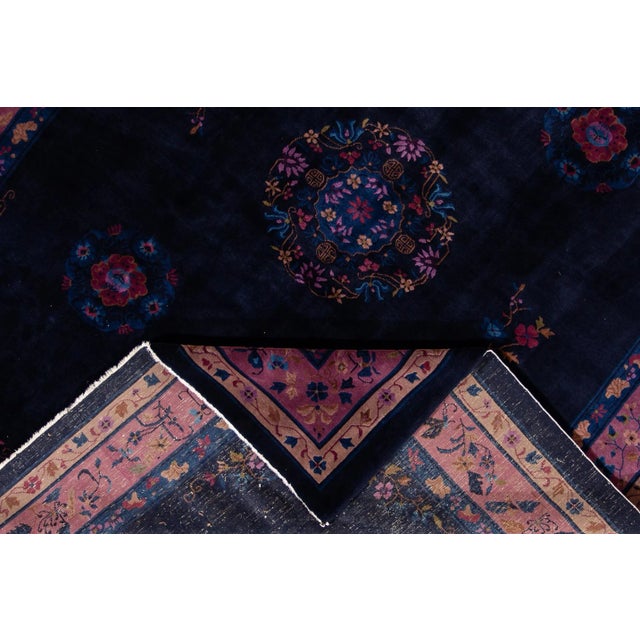 Beautiful Antique Chinese Art Deco Rug, hand-knotted wool with a dark blue field, purple frame in an allover Classic...