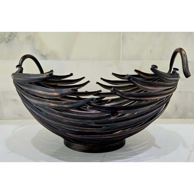 Striking vintage Palecek sculptural metal centerpiece bowl, crafted in the Philippines and designed to resemble layered...