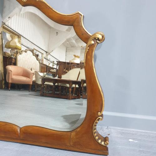 This is a very good Edwardian antique shaped walnut and parcel gilt overmantle mirror, with original bevelled mirror.
