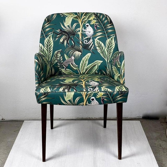 This Austrian mid-century armchair was produced by Thonet Vienna in the 1950s and has been newly upholstered with green...
