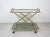 Elegant French bar trolley with solid faux bamboo brass frame and two smoked glass shelves. Marked "Rue Royal ". Its style...