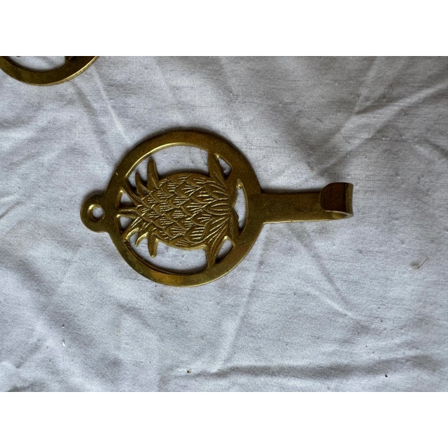 Up for consideration is a pair of brass metal pineapple wall hooks. These would look lovely in your home and they are a...