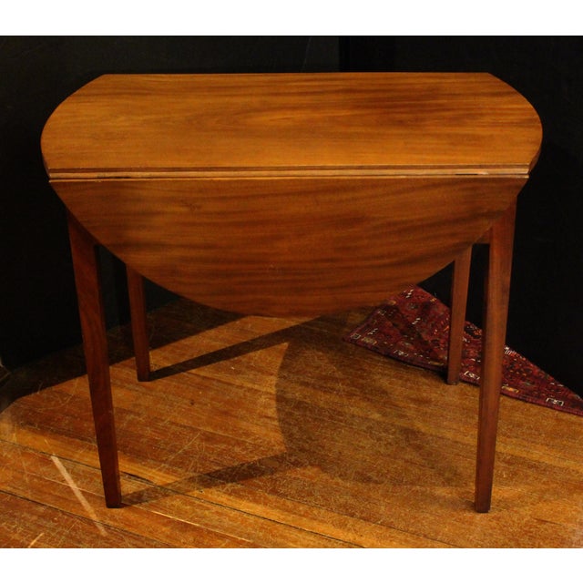 Circa 1790-1810 American oval pembroke table. Holly or box drawer stringing and original brasses. Poplar secondary wood....