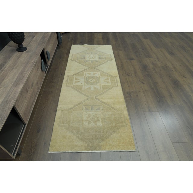 Vintage Turkish Hand-Knotted vintage rug is a semi-antique vintage runner rug. The '70s Eastern region of Turkey's unique...