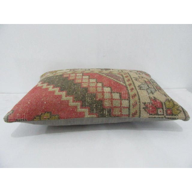 Decorative pillow cover made from a vintage Turkish handknotted rug. Backed with good quality cotton fabric. Pillow...