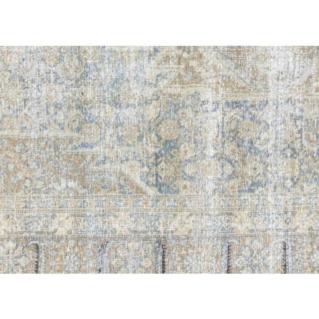 Discover the rich history and craftsmanship of a Semi Antique Persian Tabriz Rug. Measuring 6'3" x 9'10", this rug boasts...