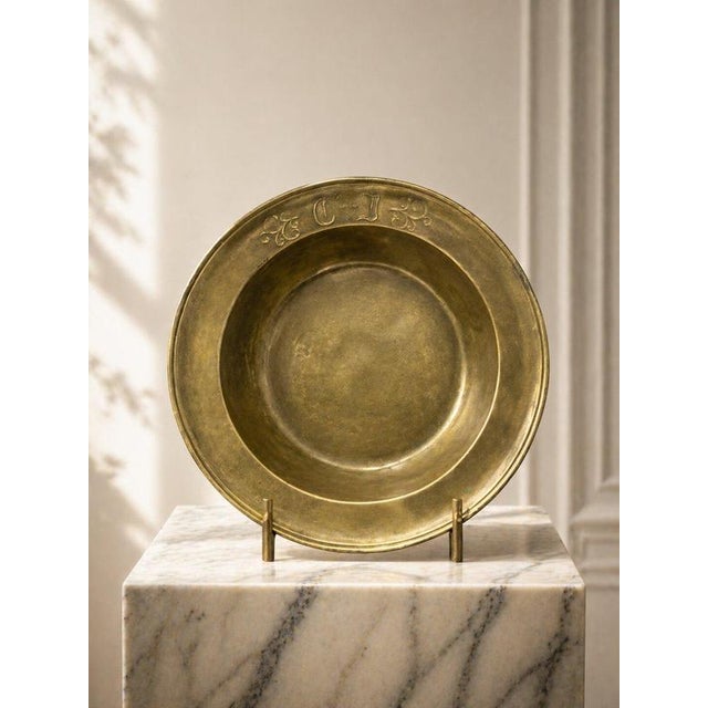A rare and beautifully aged solid bronze bowl from 18th century Sweden, showcasing a timeless simplicity paired with...