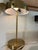 Upcycled gold toned metal desk lamp adorned with an assortment of colorful semiprecious stone agate accents on the shade....