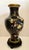 This beautiful vintage cloisonné vase features an elegant black ground decorated with intricate gilt cloud motifs,...