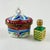 From Rochard, Limoges Paris, a hand enameled trinket box, a scent chest with a metal caged glass bottle, circa 1970-1980s....
