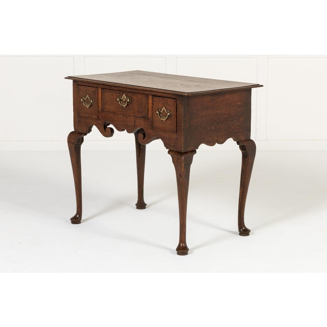 18th century english oak lowboy an 18th century english oak lowboy. with three drawers arranged in a frieze with an...