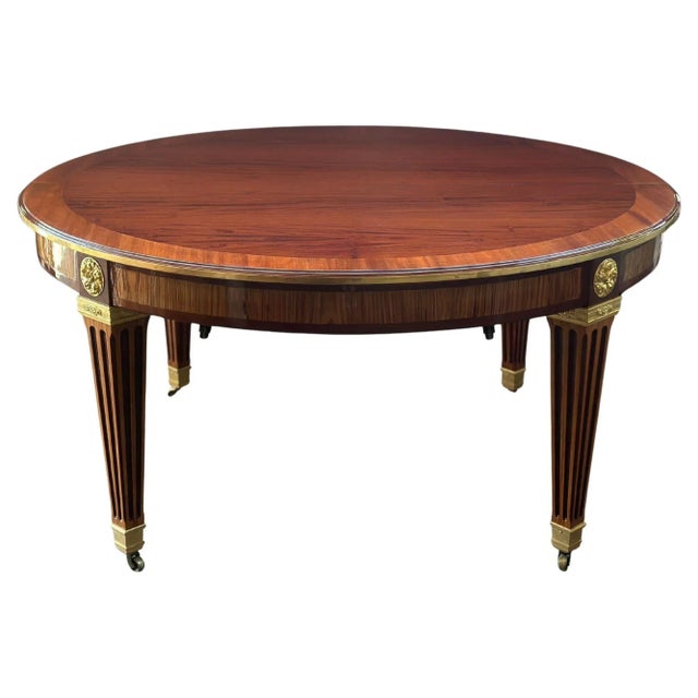 Stunning French 19th-century Louis XVI style dining table. Recently REFINISHED and Elegantly designed with gilt bronze...
