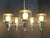 Very handsome 1970s chrome and clear glass 5-light chandelier. Unmarked but likely by Gaetano Sciolari for Lightolier....