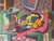 A vibrant 1950s Cubist Modernist still life painting featuring a bold geometric composition of fruit, pottery, and...