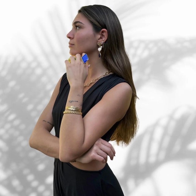 Blue Cat Eye Stone Stylish Chunky Gold Ring a captivating accessory that combines bold design with mystical allure. This...