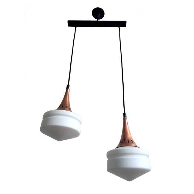 Italian pendant lamp, in the manner of Stilnovo and Arredoluce design. Two milky white opal glass and copper lamp shade....