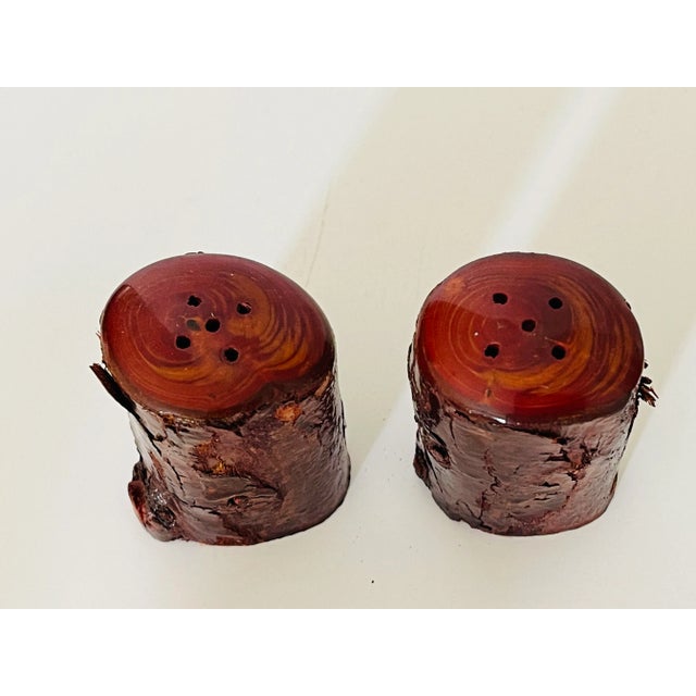 Vintage faux wood salt and pepper shakers pair.