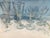 Elegant vintage crystal stemware set featuring delicately etched bowls and faceted stems. This coordinated set of twelve...