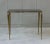 This set of three French nesting tables is a beautiful blend of black glass and brass, reflecting the distinctive style of...