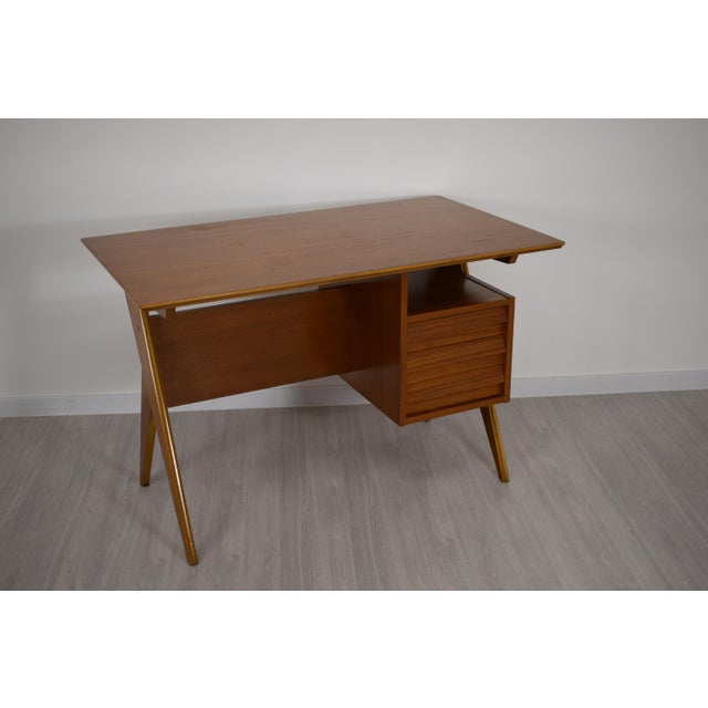 Elegant teak writing desk, made in Italy in the 1960s, with a simple yet sophisticated design, ideal for both modern and...