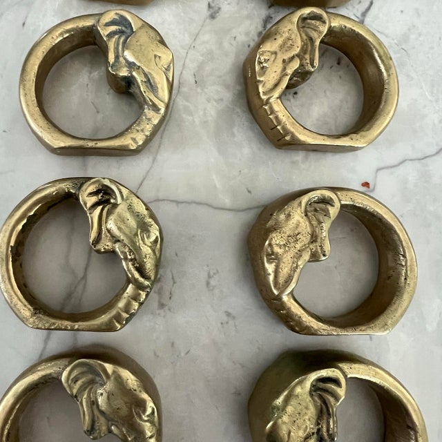 Set of 8 vintage brass napkin rings with elephant design. A great way to add a whimsy flair to your table scape! Features...