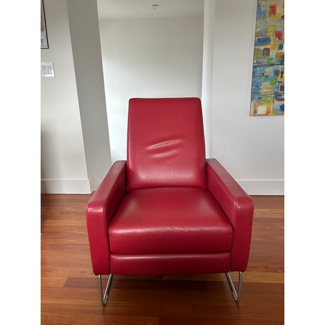Authentic Design Within Reach Flight Recliner in vibrant red leather with stainless steel sled base. Designed by Jeffrey...