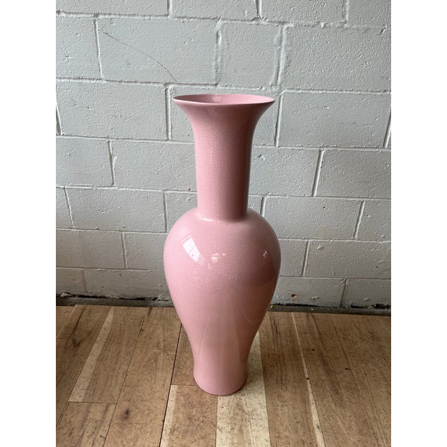 A striking large-scale ceramic floor vase by Jaru of California, executed in a soft blush pink crackle glaze. The...